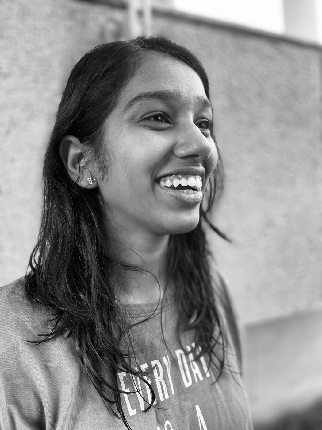 Close portrait of a woman smiling and looking to the side